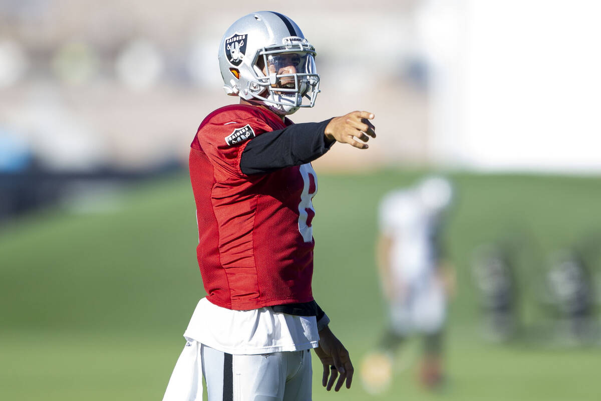 Raiders quarterback Marcus Mariota (8) reacts after throwing a pass during their NFL training c ...