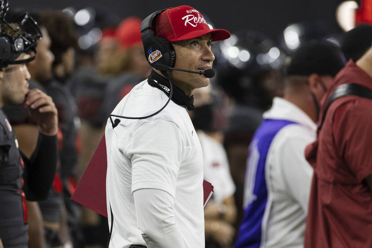 UNLV Rebels head coach Marcus Arroyo watches the clock during the fourth quarter of an NCAA foo ...