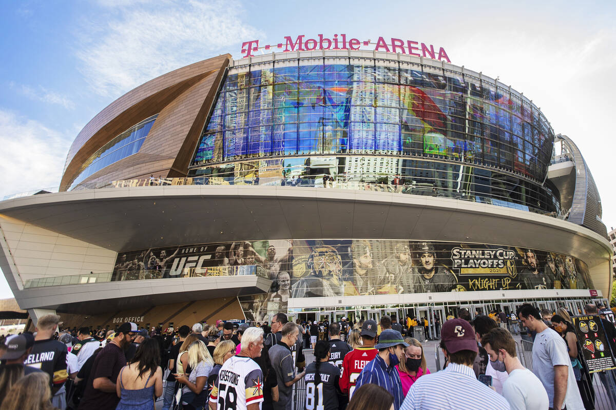 Fans wait to enter T-Mobile Arena before the start of Game 7 of an NHL Stanley Cup first-round ...