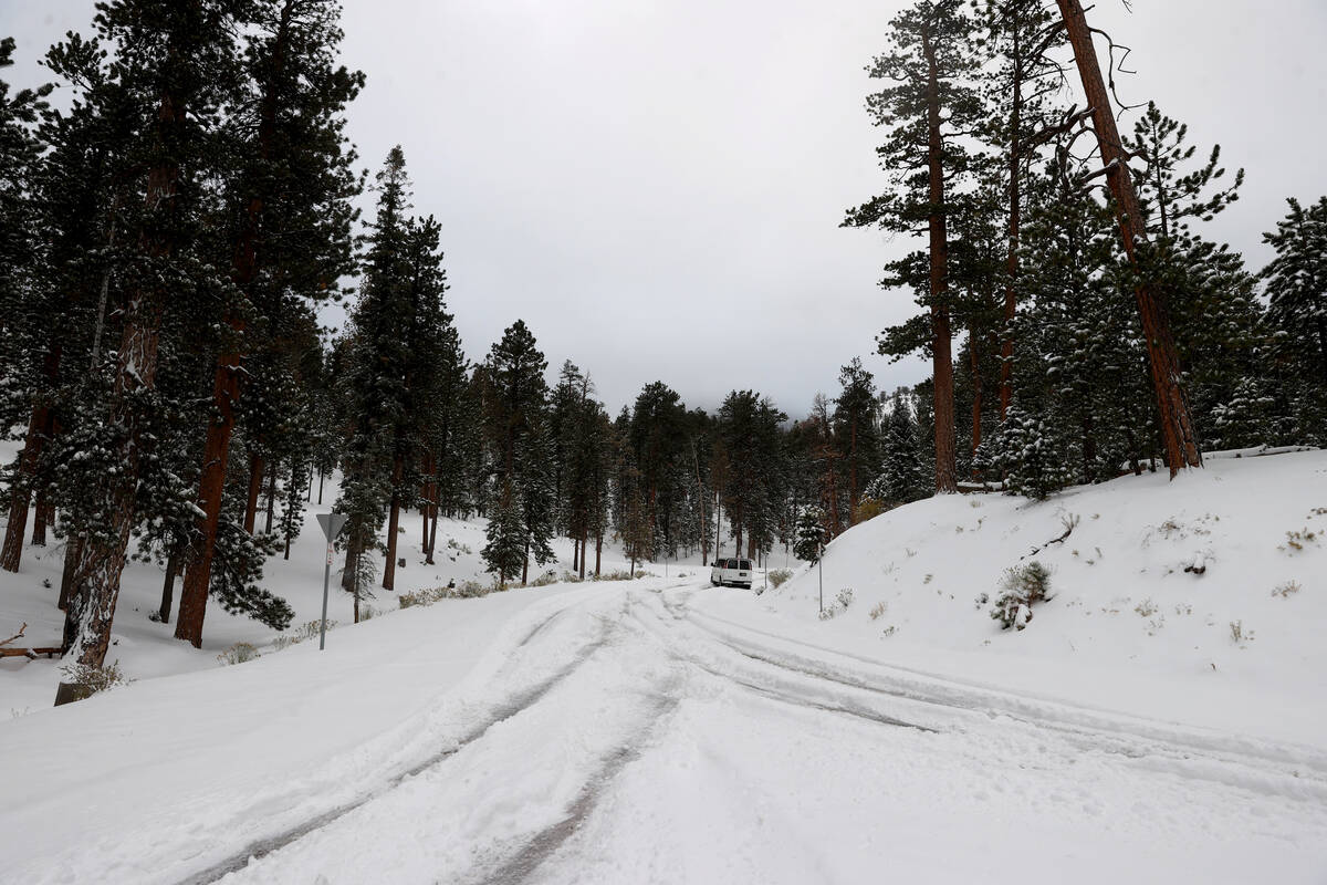 A shuttle van sits stuck in the snow at the Lee Canyon ski area on Mount Charleston northwest o ...
