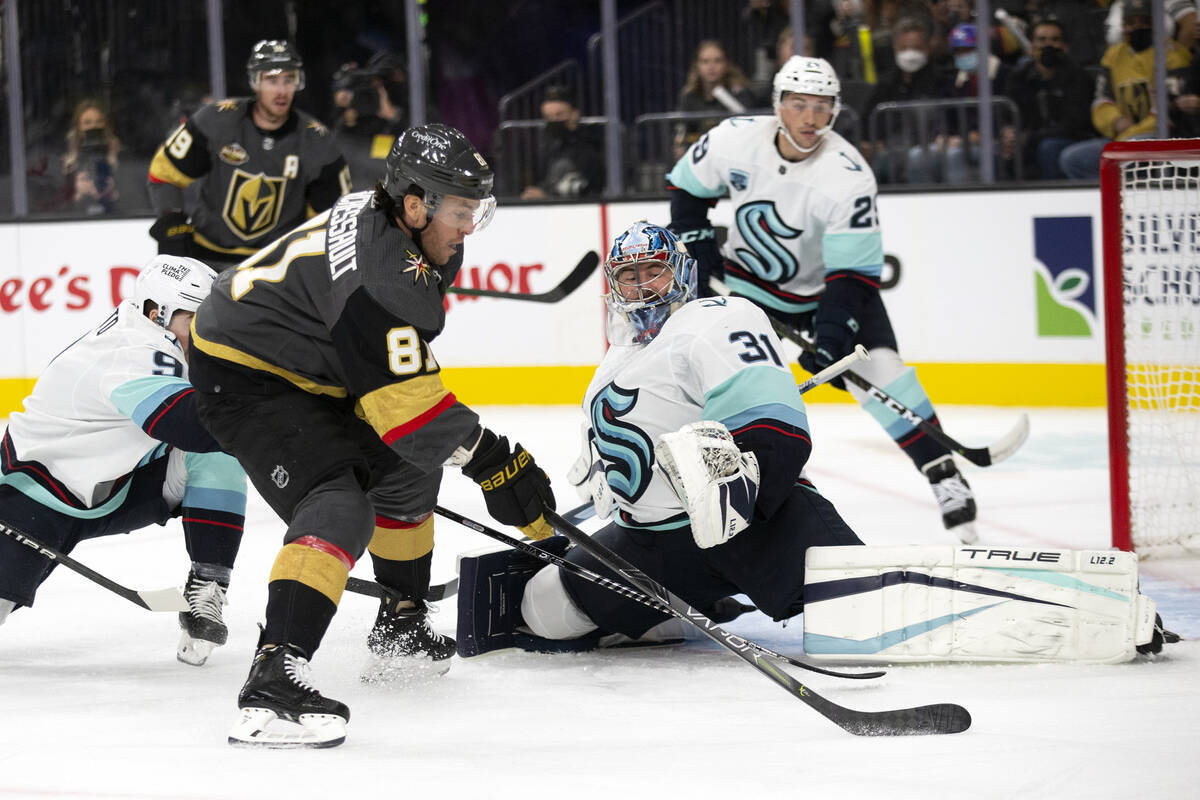 Golden Knights center Jonathan Marchessault (81) is about to score a goal on Kraken goaltender ...