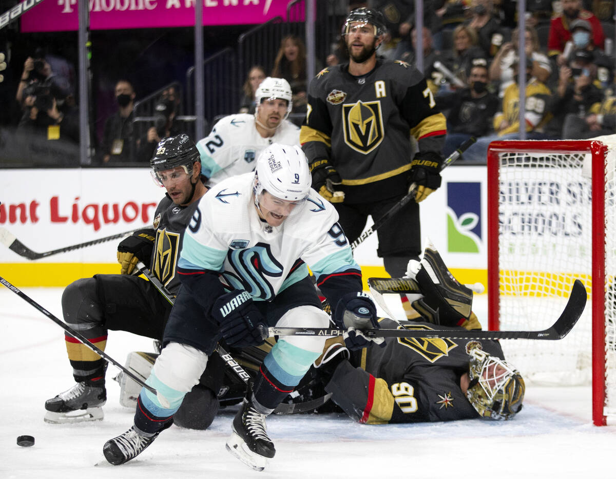 Kraken center Ryan Donato (9) celebrates after scoring a goal on Golden Knights goaltender Robi ...