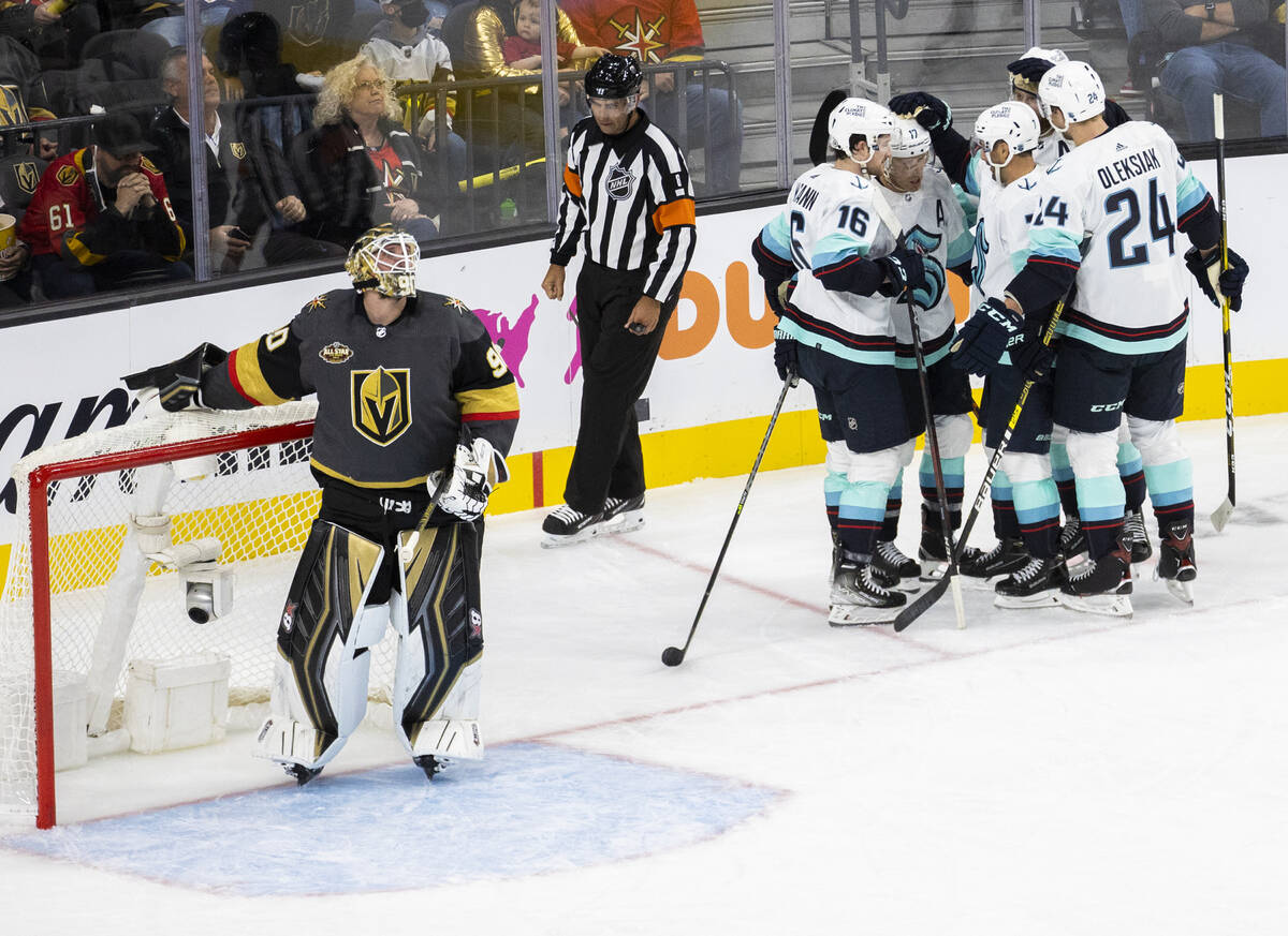 Seattle Kraken players celebrate after scoring a goal in the second period against Vegas Golden ...