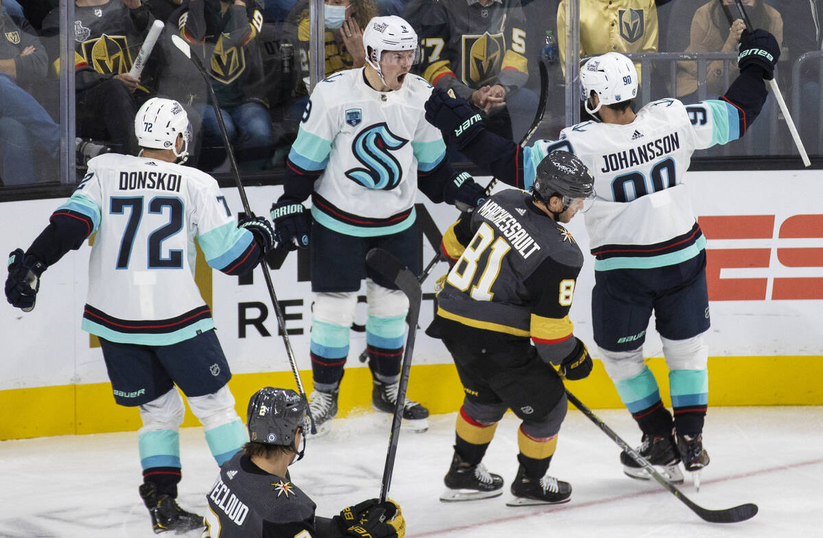 Seattle Kraken center Ryan Donato (9) celebrates a goal with teammates in front of Vegas Golden ...