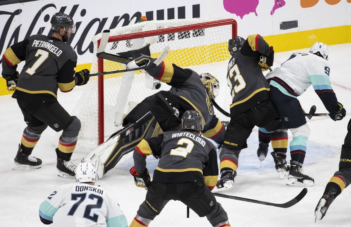 Seattle Kraken center Ryan Donato (9) scores against Vegas Golden Knights goaltender Robin Lehn ...