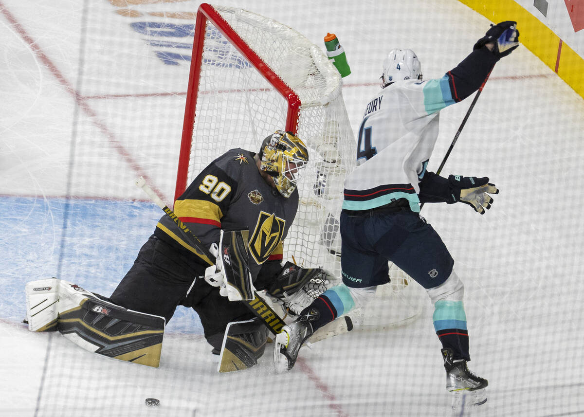 Vegas Golden Knights goaltender Robin Lehner (90) makes a save against Seattle Kraken defensema ...