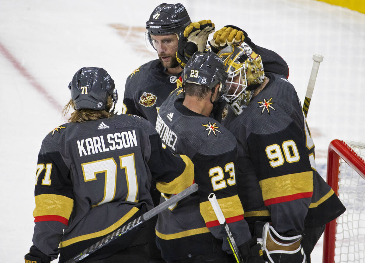 Vegas Golden Knights center William Karlsson (71) and Vegas Golden Knights defenseman Alec Mart ...