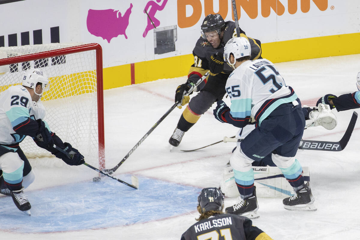 Vegas Golden Knights center Jonathan Marchessault (81) scores against Seattle Kraken defenseman ...