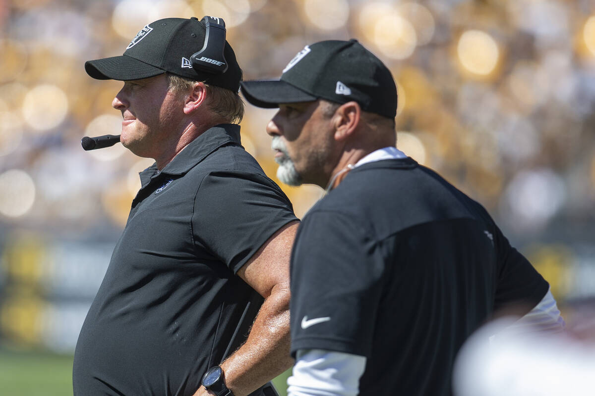 Raiders head coach Jon Gruden, left, looks on from the sideline with special teams coach Rich B ...