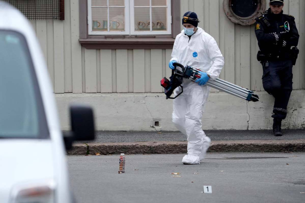 Police work near a site after a man killed some people in Kongsberg, Norway, Thursday, Oct. 14, ...