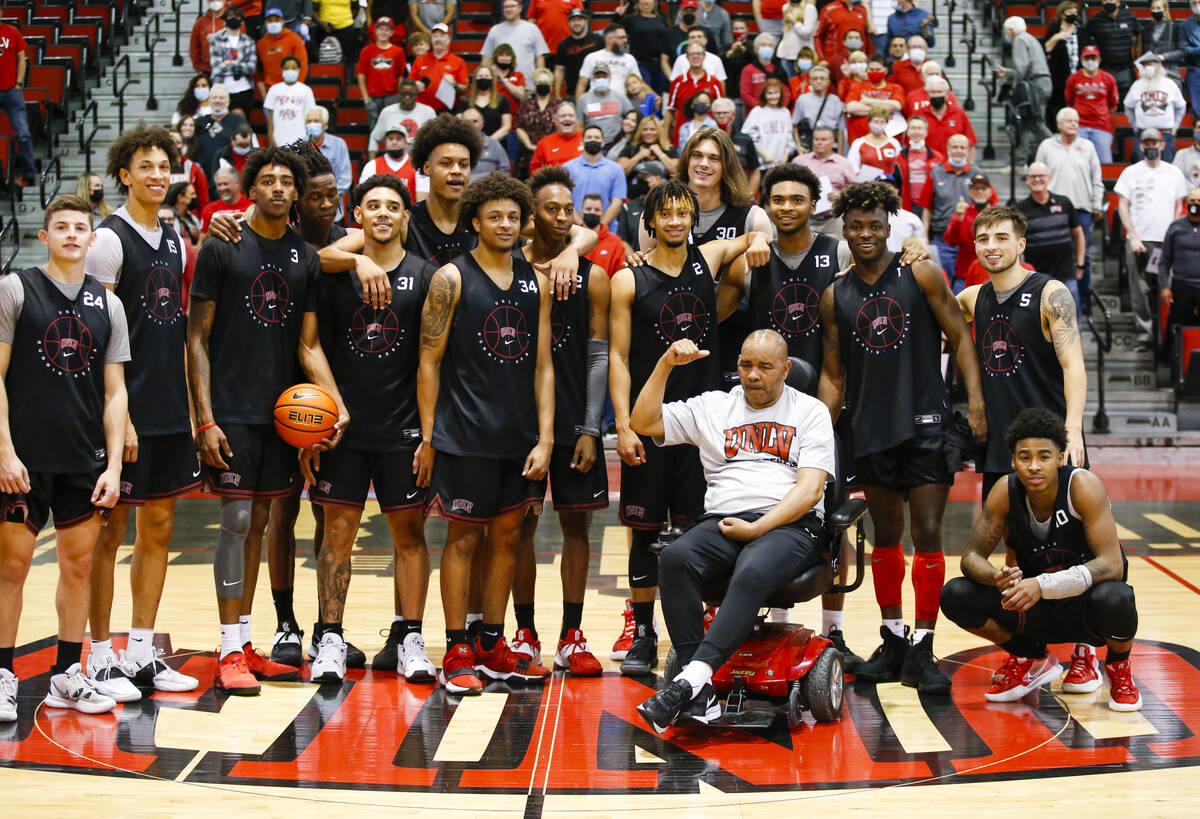 UNLV basketball players pose for a picture with former player Robert Smith after an open basket ...