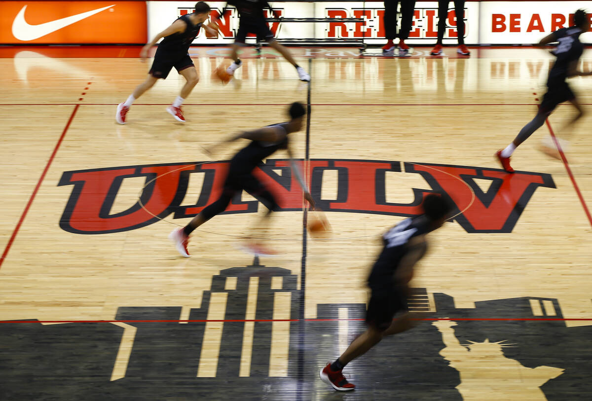 UNLV players participate in drills during an open basketball practice and fundraiser for former ...