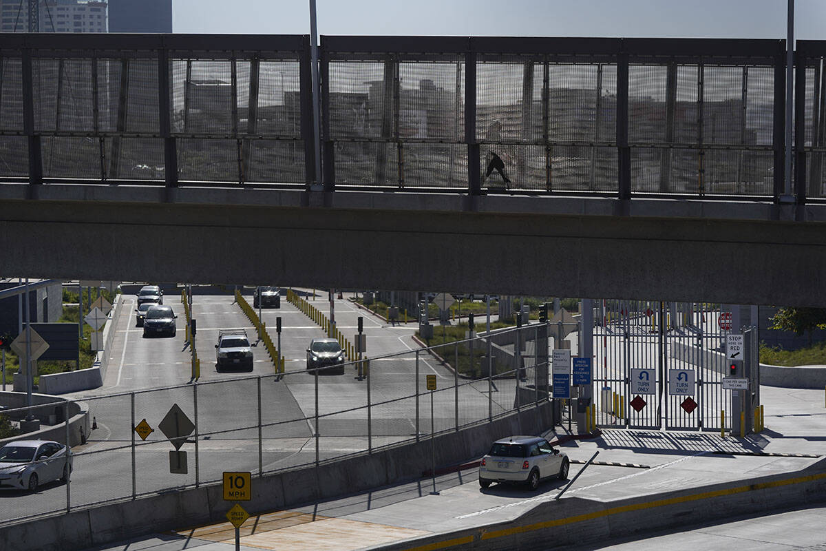 A few cars make their way north to cross into the United States from Tijuana, Mexico, Wednesday ...