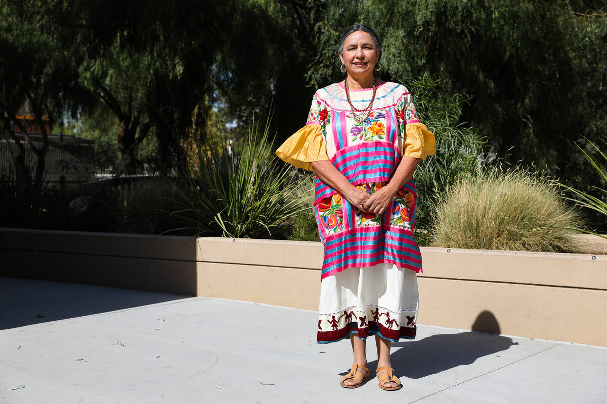 Irma Varela, cultural program supervisor, shows her traditional clothing from the Mexican state ...