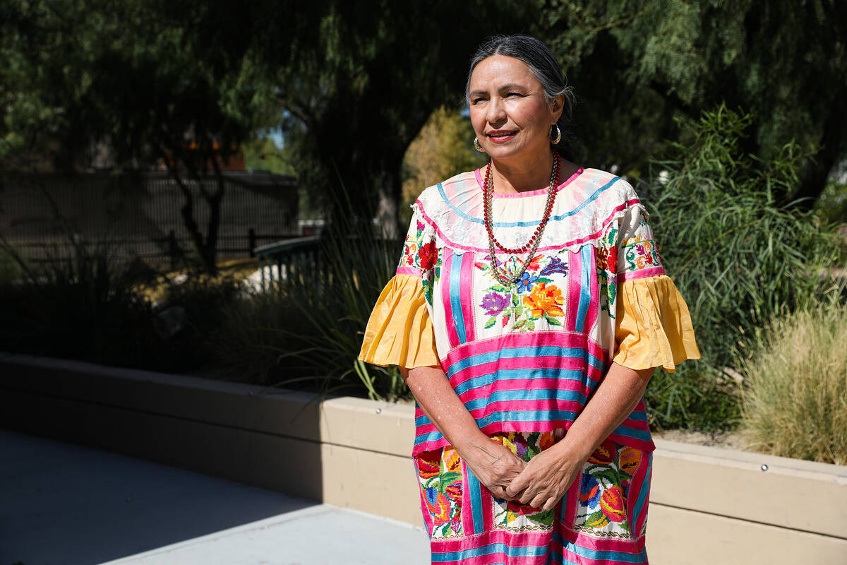 Irma Varela, cultural program supervisor, shows her traditional clothing from the Mexican state ...