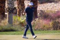 Keith Mitchell raises his hand after sinking a putt from on the 14th hole during the second rou ...