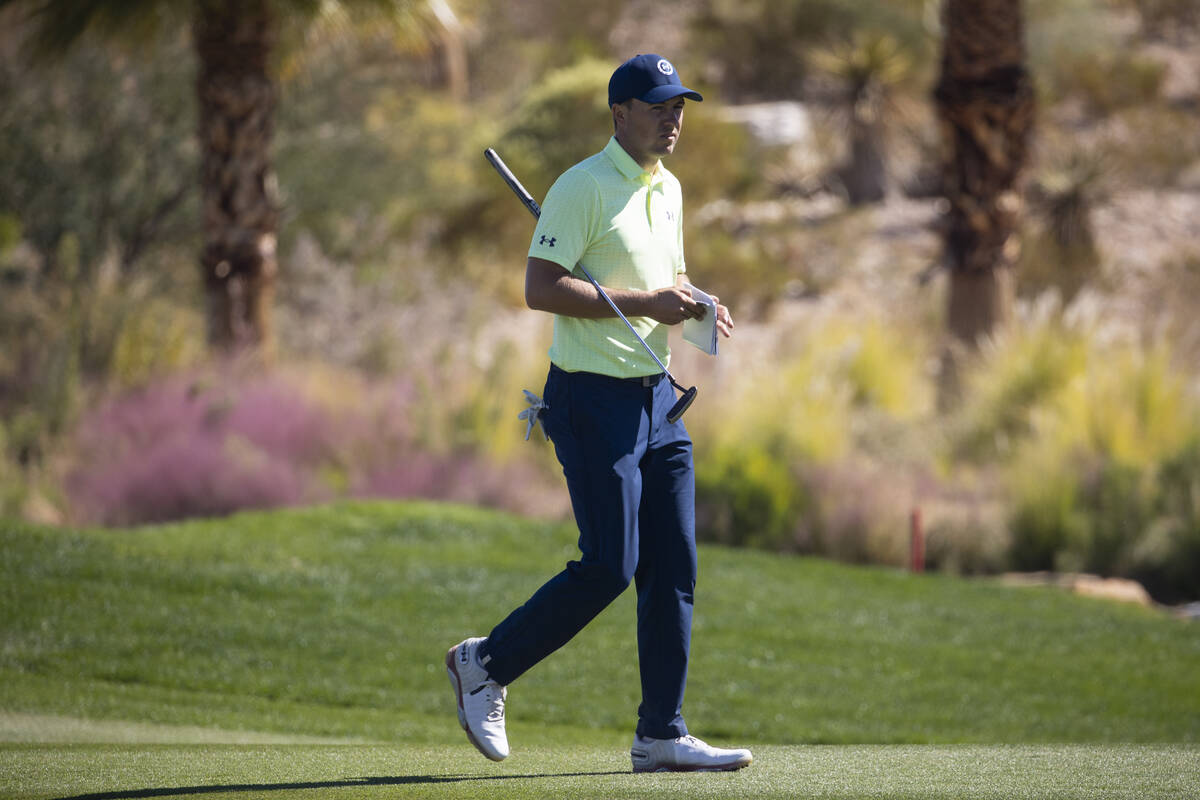 Jordan Spieth walks the 12th fairway after hitting the ball tot he green during the second roun ...