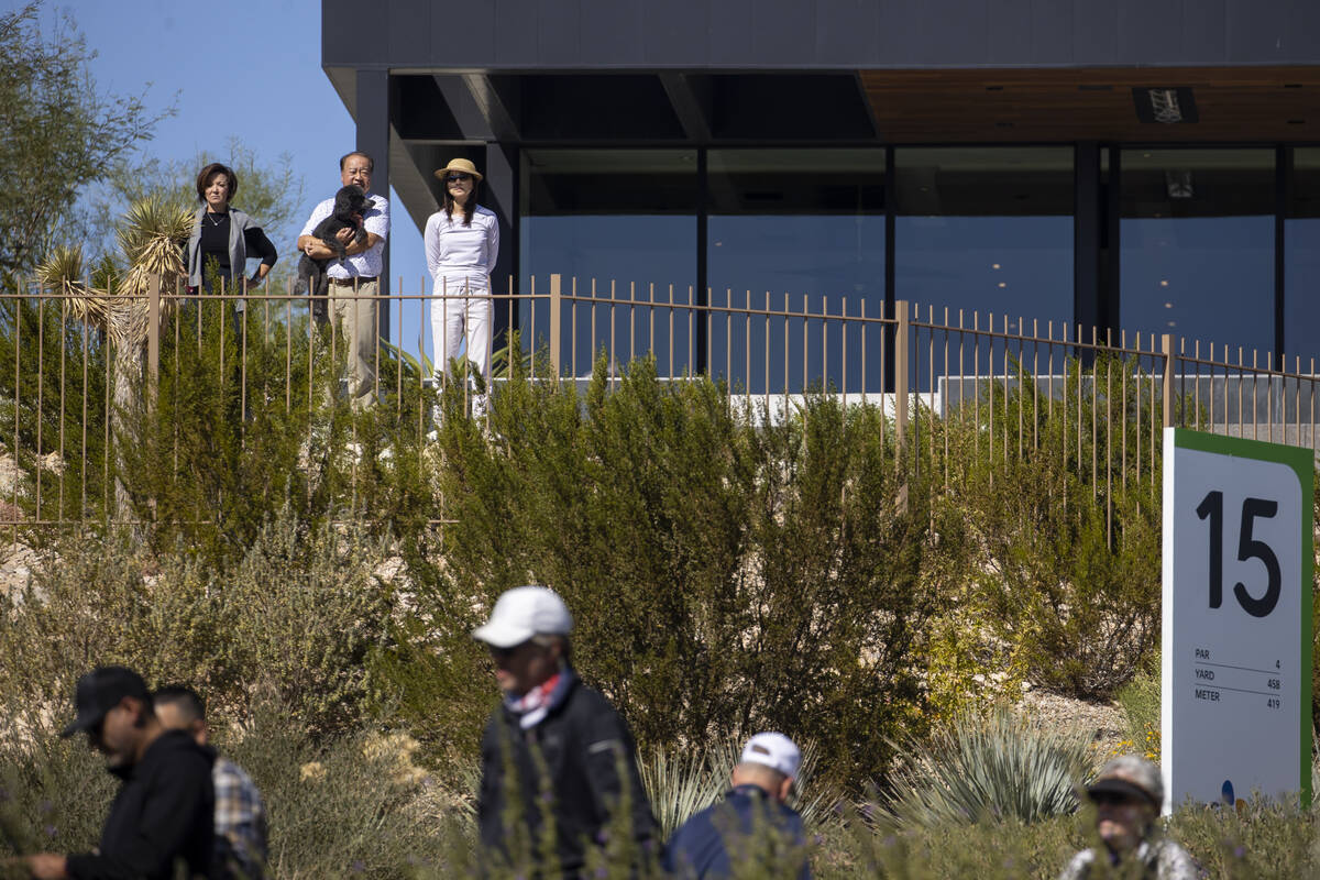 People watch down at the 15th tee box from their home during the second round of the CJ Cup gol ...