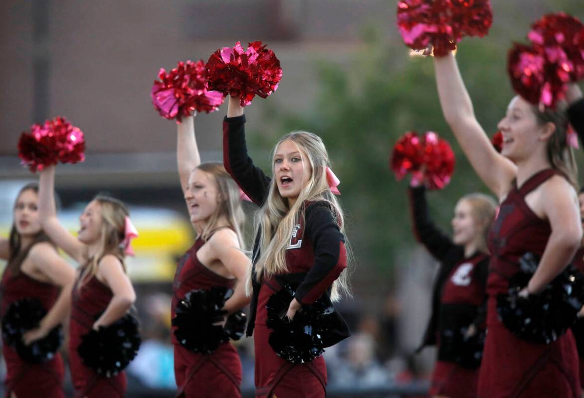 Faith Lutheran School's cheerleaders performs before a football game against Desert Pines High ...