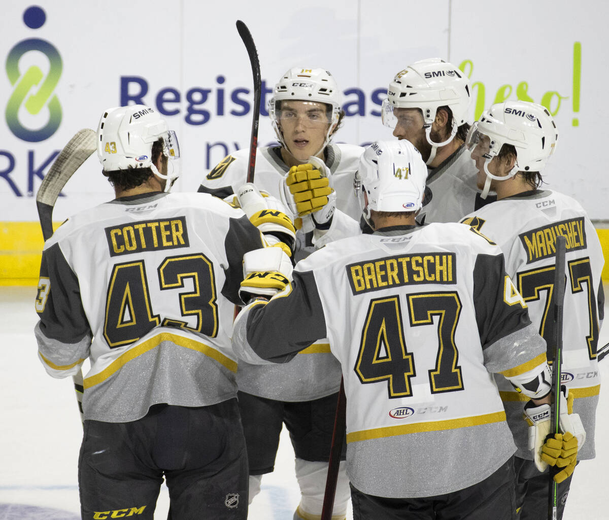Silver Knights players celebrate a second period goal during an AHL hockey game against the Col ...