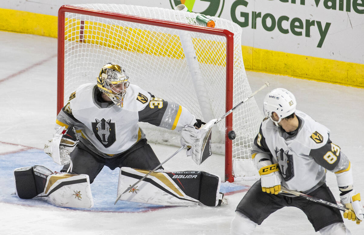 Silver Knights goaltender Logan Thompson (36) makes a save in the second period during an AHL h ...