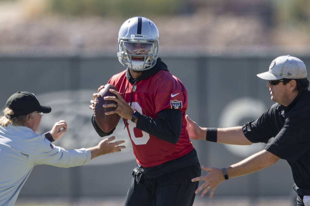 Raiders quarterback Marcus Mariota (8) works through a drill during a practice session at the R ...