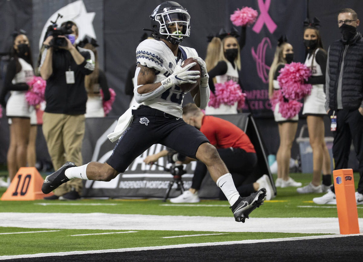Utah State Aggies wide receiver Deven Thompkins (13) hauls in a touchdown catch in the first ha ...