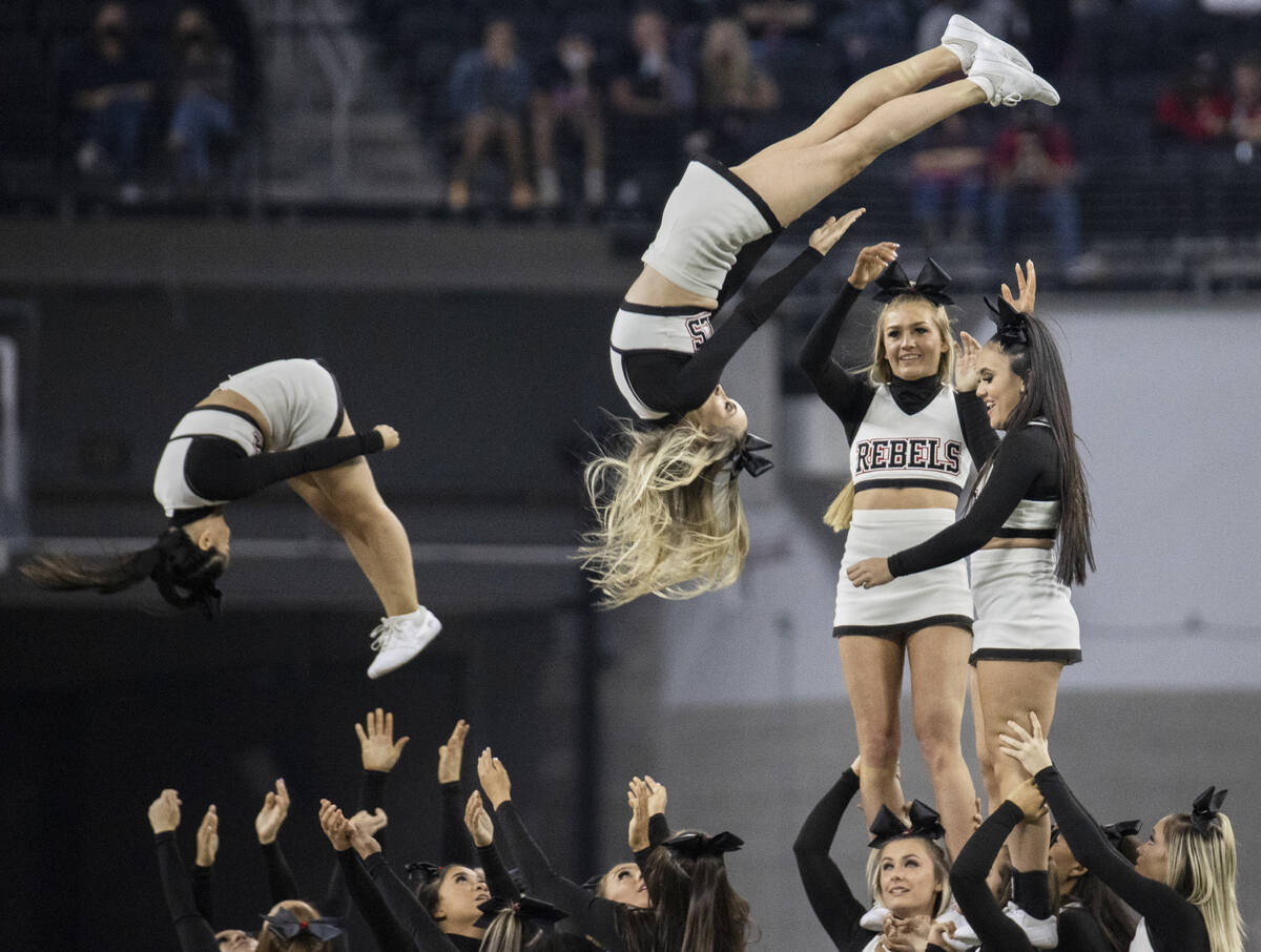 UNLV cheerleaders perform in the first half during an NCAA college football game against Utah S ...