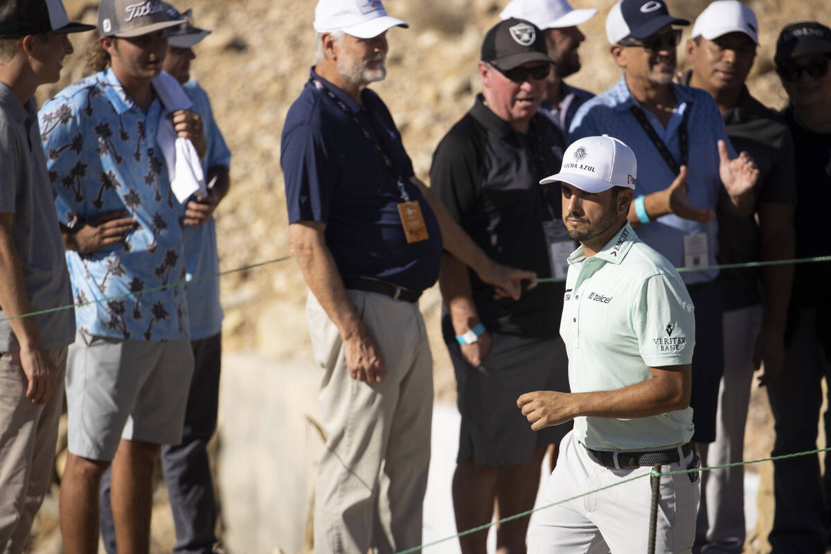 Abraham Ancer leaves the 18th green after completing the third round of the CJ Cup golf tournam ...