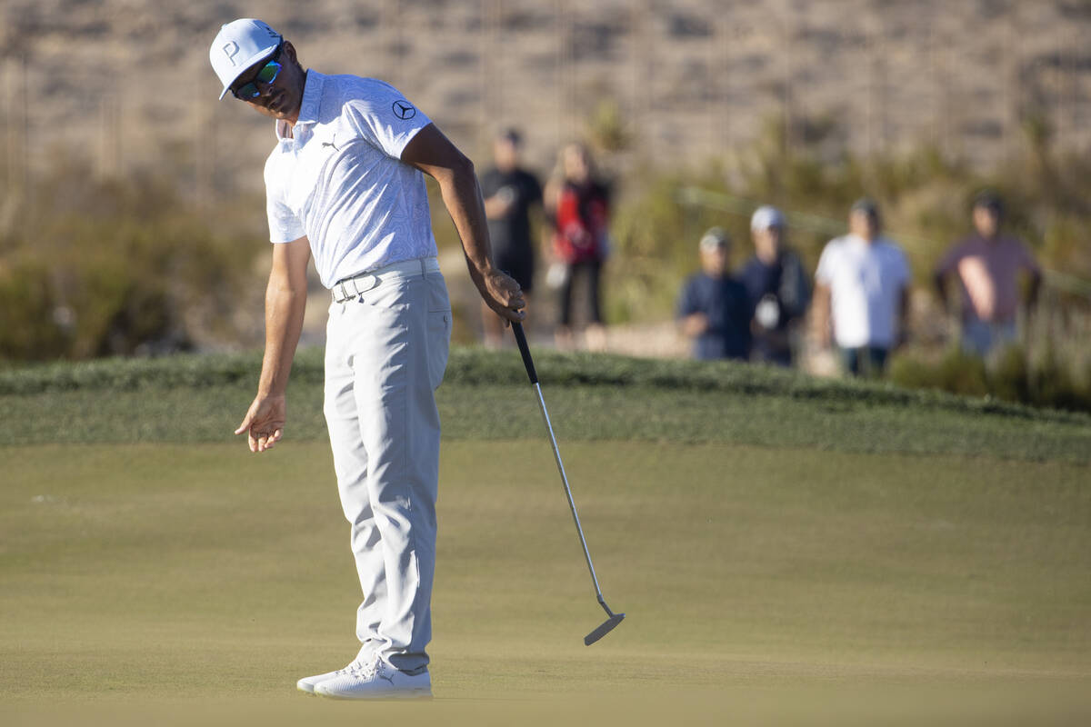 Rickie Fowler watches the ball miss the 18th hole after a putt during the third round of the CJ ...