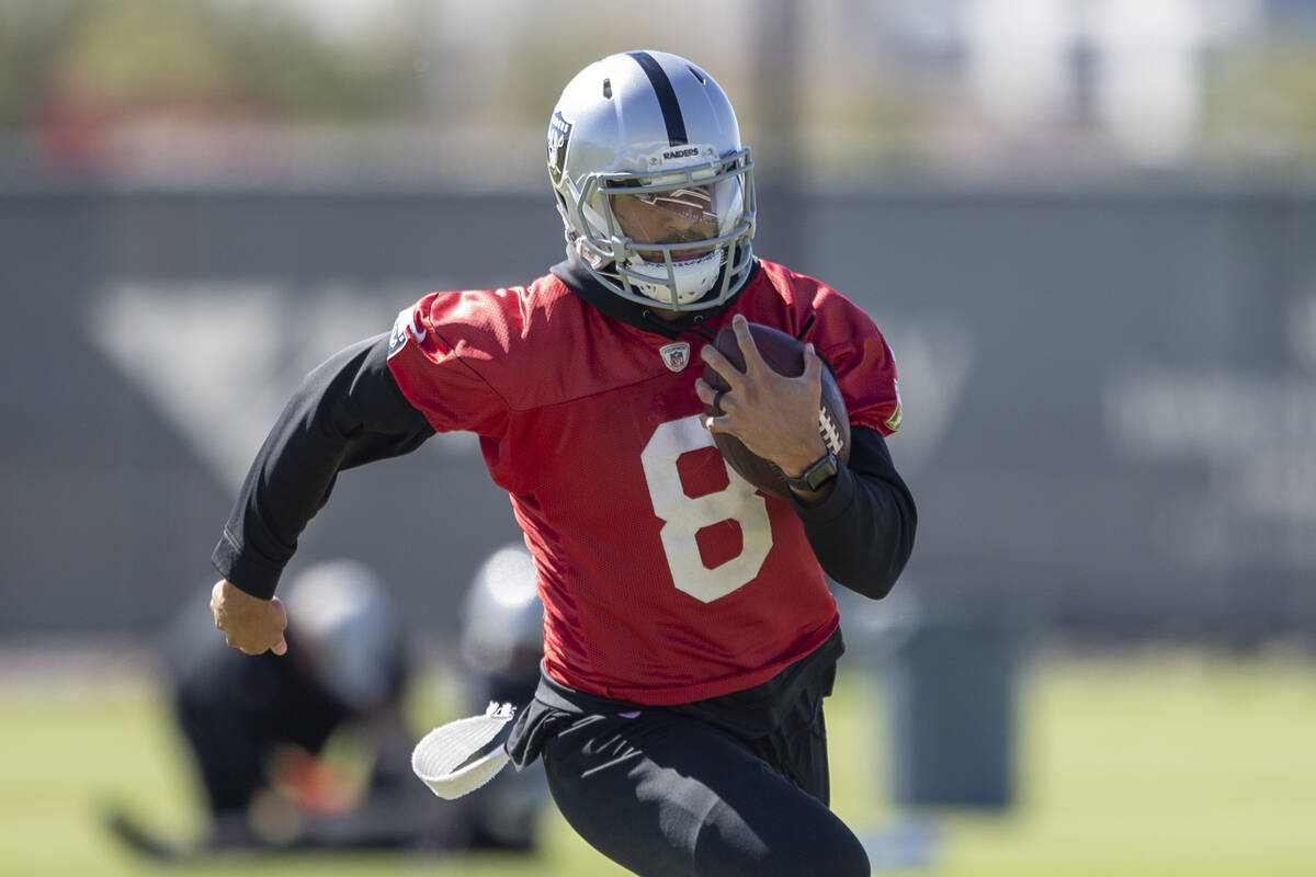 Raiders quarterback Marcus Mariota (8) runs with the football during a practice session at the ...