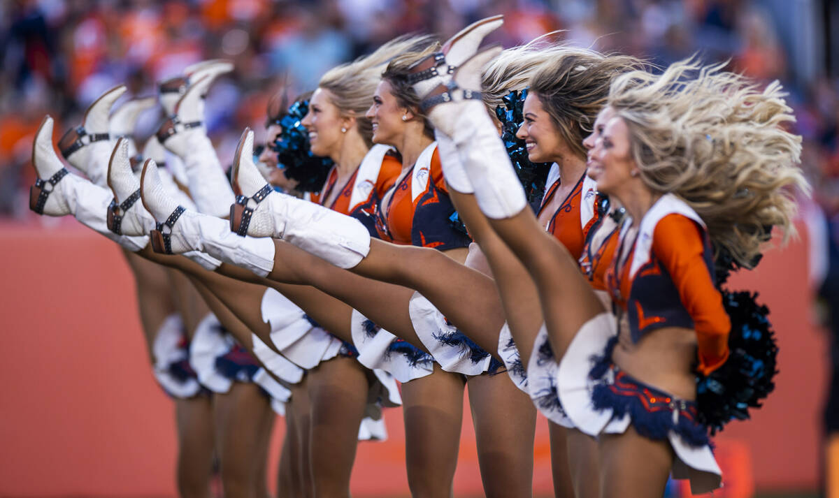 The Bronco Belles high kick during a timeout performance as the Raiders battle the Denver Bronc ...