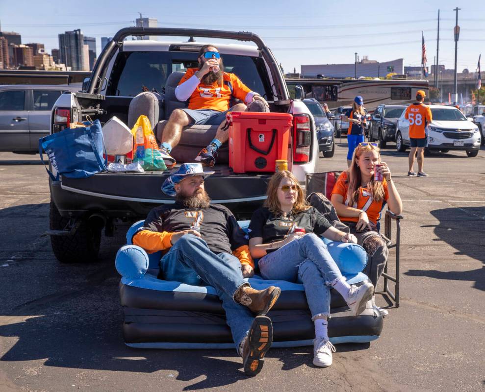 Denver Broncos fans Nate Van Cleave, Counterclockwise from top, Mike Miles, Reagan Miles and Lu ...