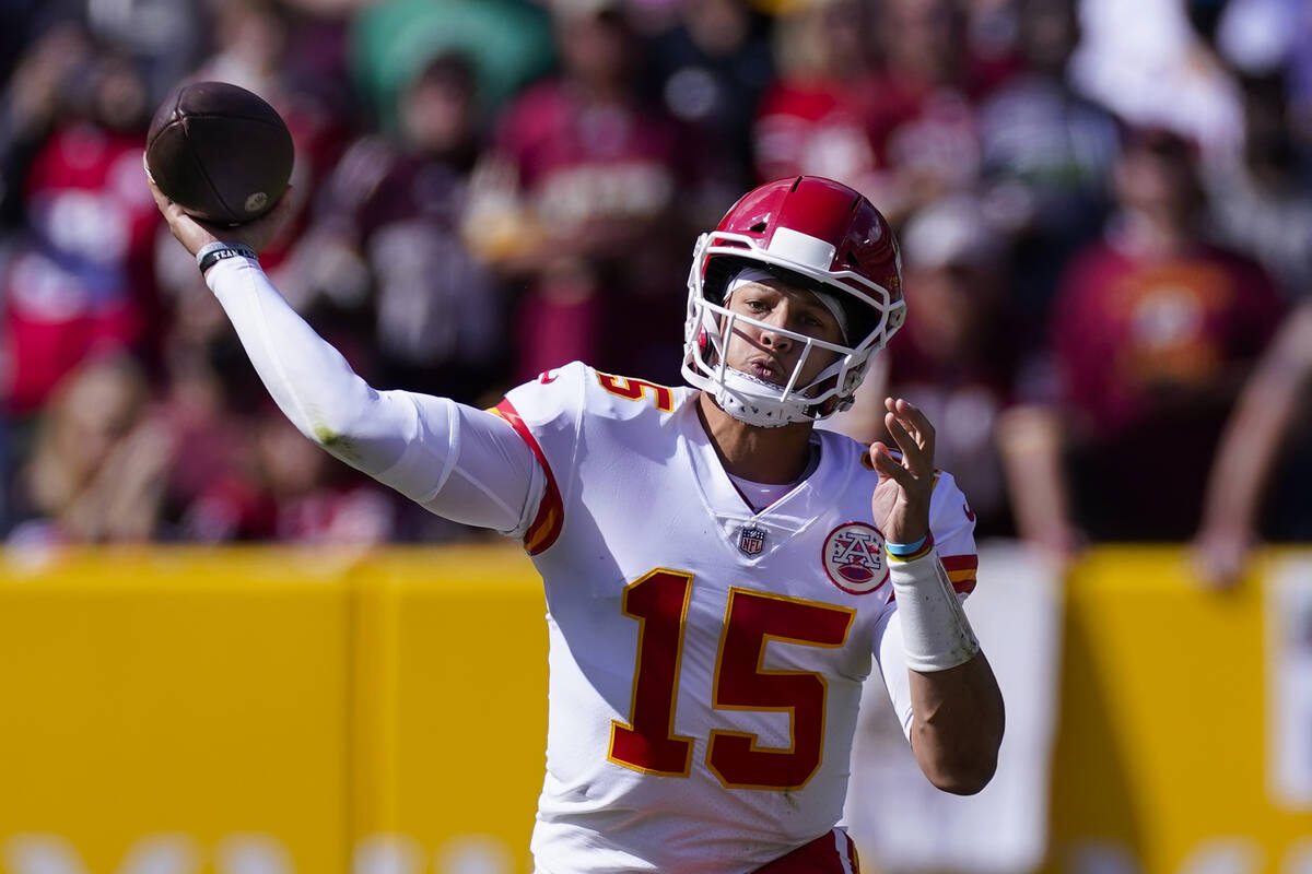 Kansas City Chiefs quarterback Patrick Mahomes (15) passing the ball during the first half of a ...