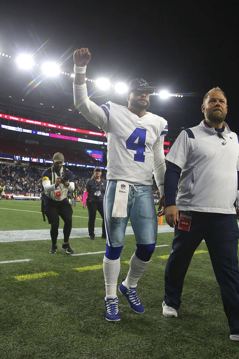 Dallas Cowboys quarterback Dak Prescott (4) gestures to the crowd as he walks off the field fol ...