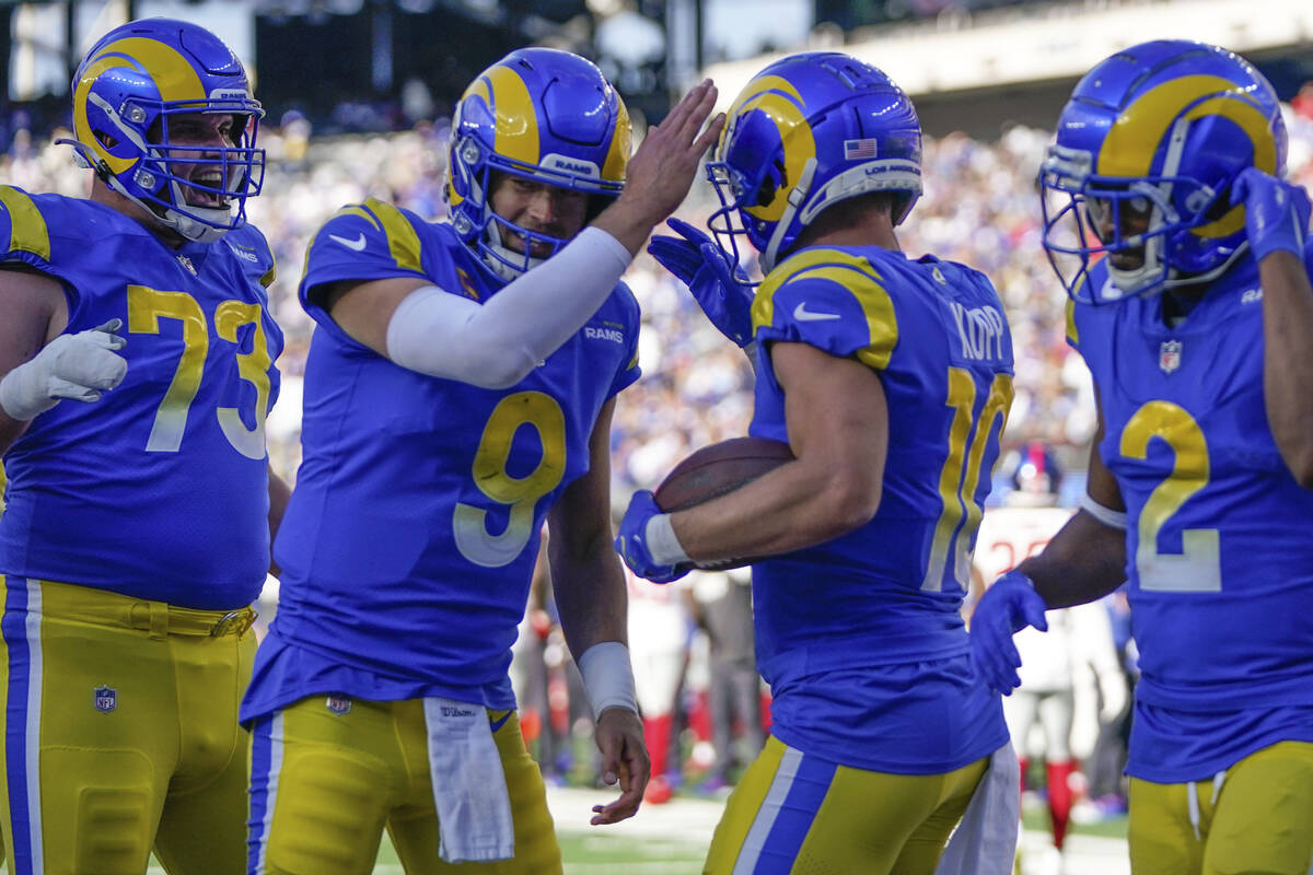 Los Angeles Rams' Cooper Kupp, second from right, celebrates his touchdown with quarterback Mat ...