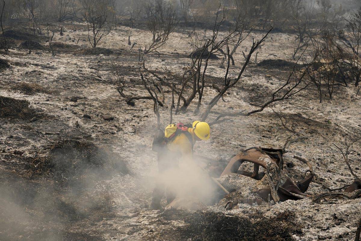 In this Oct. 13, 2021, file photo, County of Santa Barbara Fire Department firefighters extingu ...