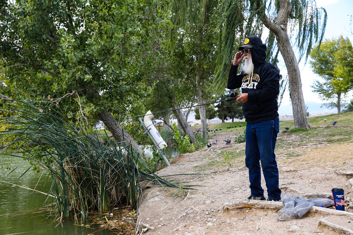 Randy Jones fishes in the cold at Floyd Lamb Park in Las Vegas, Monday, Oct. 18, 2021. Rachel A ...