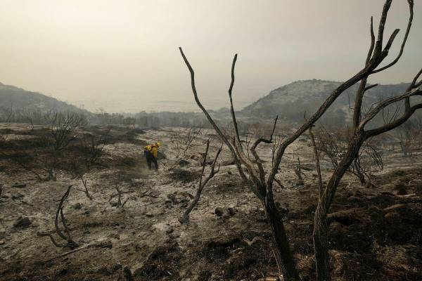 In this Wednesday, Oct. 13, 2021 file photo, County of Santa Barbara Fire Department firefighte ...