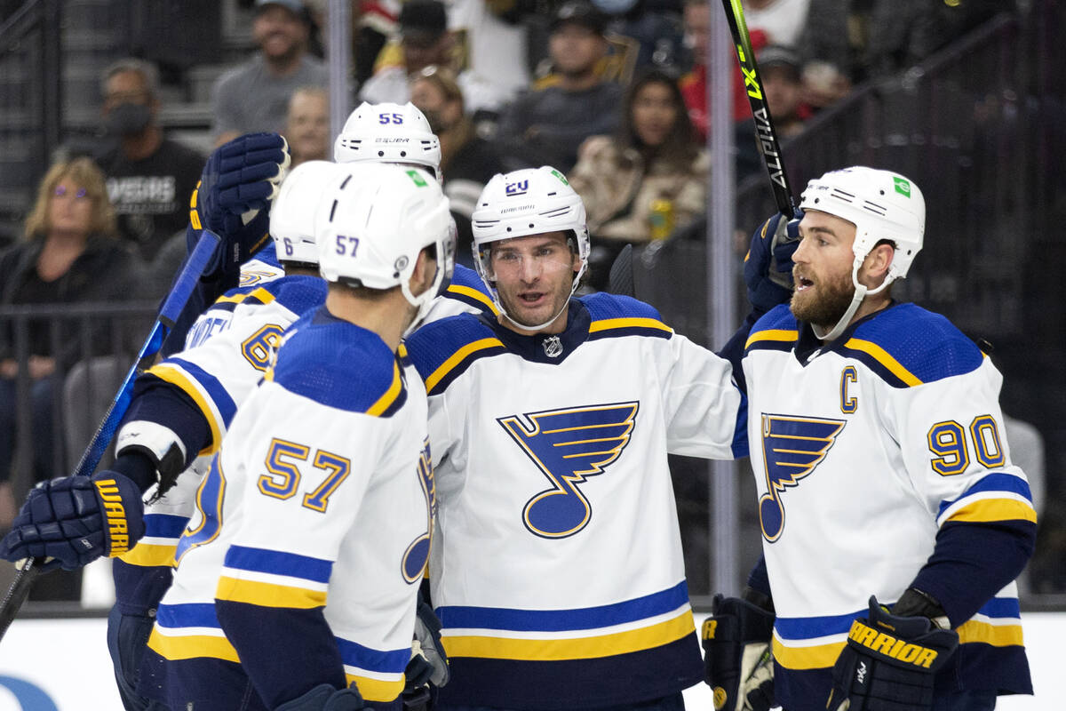 Blues left wing David Perron (57), left wing Brandon Saad (20) and center Ryan O'Reilly (90) ce ...