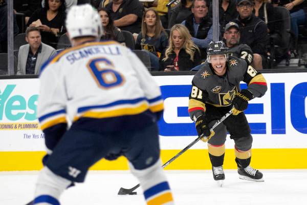 Golden Knights center Jonathan Marchessault (81) looks to pass while Blues defenseman Marco Sca ...
