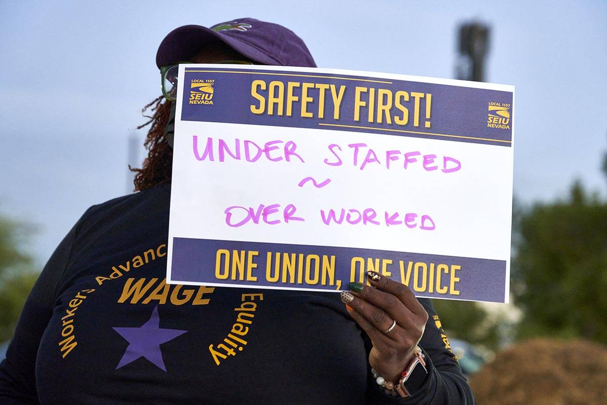 An employee with SEIU, Local 1107, protests unsafe working conditions in the Clark County Depar ...