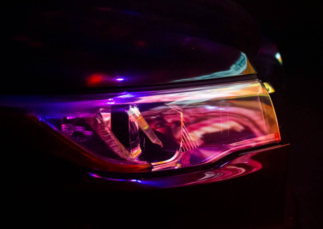 A video is reflected in a car headlight at the start of the Horrorwood Video drive-in at the Ma ...