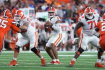 Clemson quarterback D.J. Uiagalelei (5) looks for a receiver during the fourth quarter of the t ...
