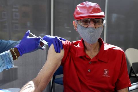 Charles "Buddy Charles" Wucinich, 84, of Las Vegas gets a Pfizer COVID-19 vaccine boo ...