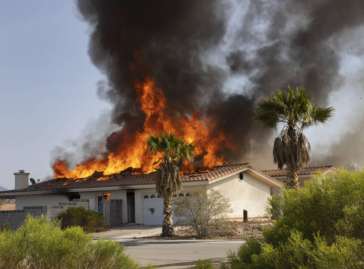 A controlled burn of a house at Schuster Street, on Friday, Sept. 24, 2021, in Las Vegas. (Bizu ...