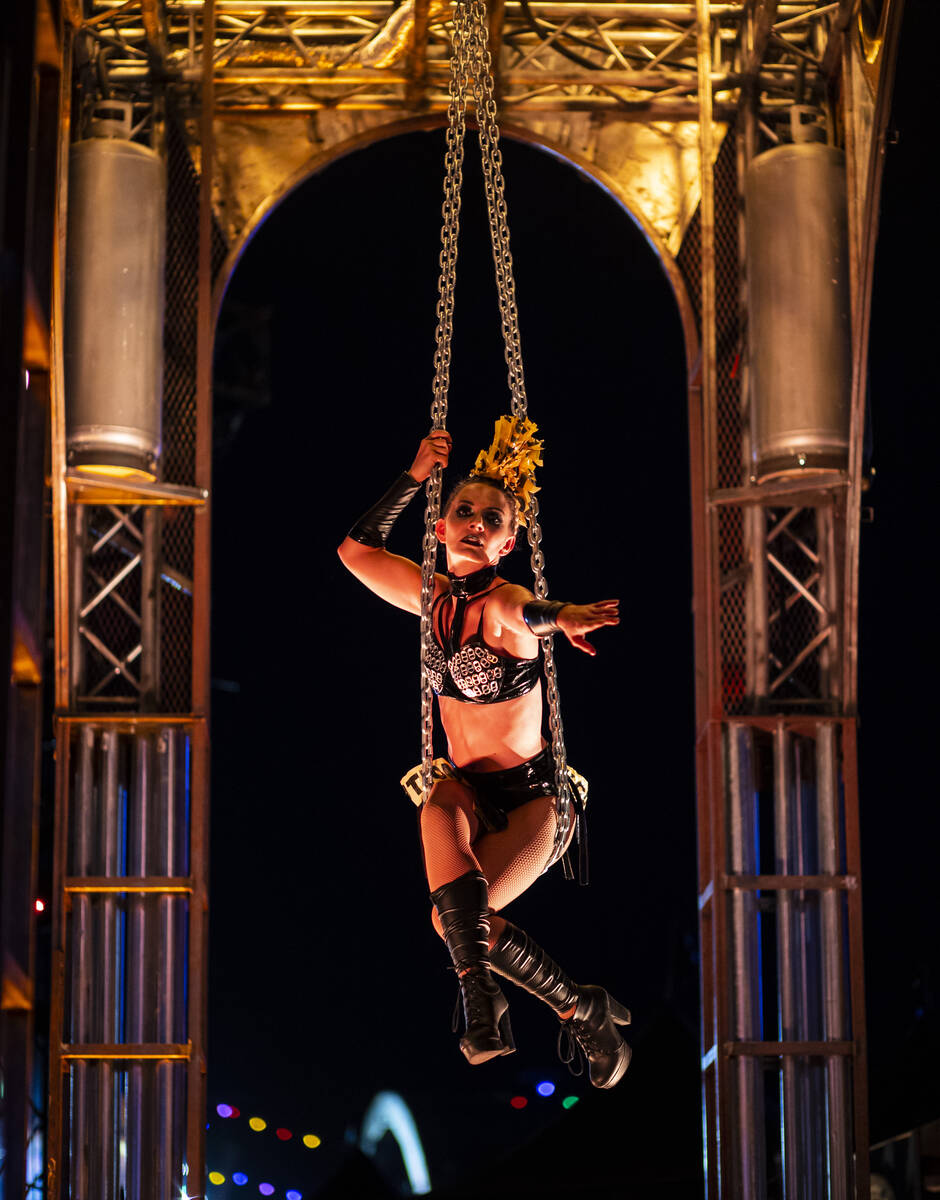 Aerialist Emma Byers performs with chains in Nomads Land during the final day of the Electric D ...