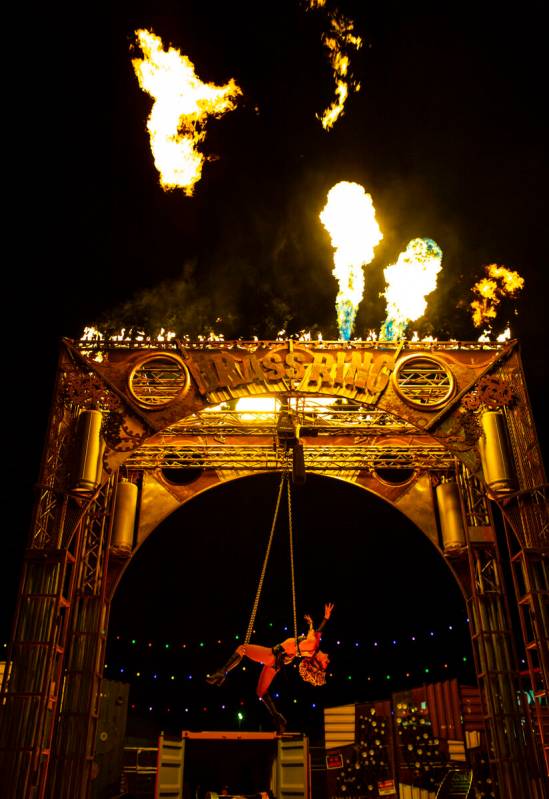 Aerialist Emma Byers performs with chains in Nomads Land during the final day of the Electric D ...
