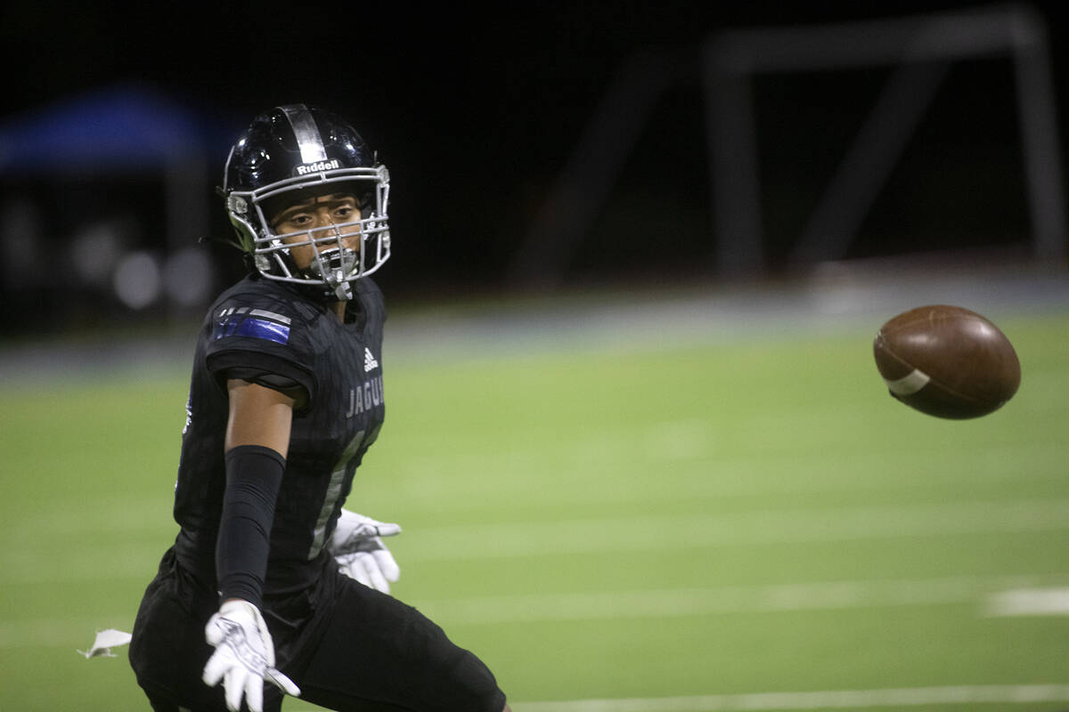 Desert Pines' Jaylin Morrison (11) misses a pass during the first half of a high school footbal ...