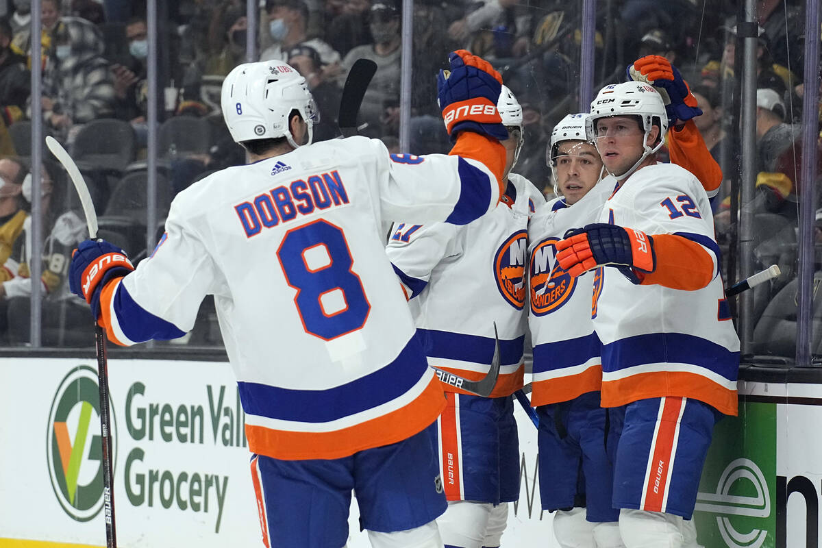 New York Islanders center Josh Bailey (12) celebrates with center Jean-Gabriel Pageau (44) and ...